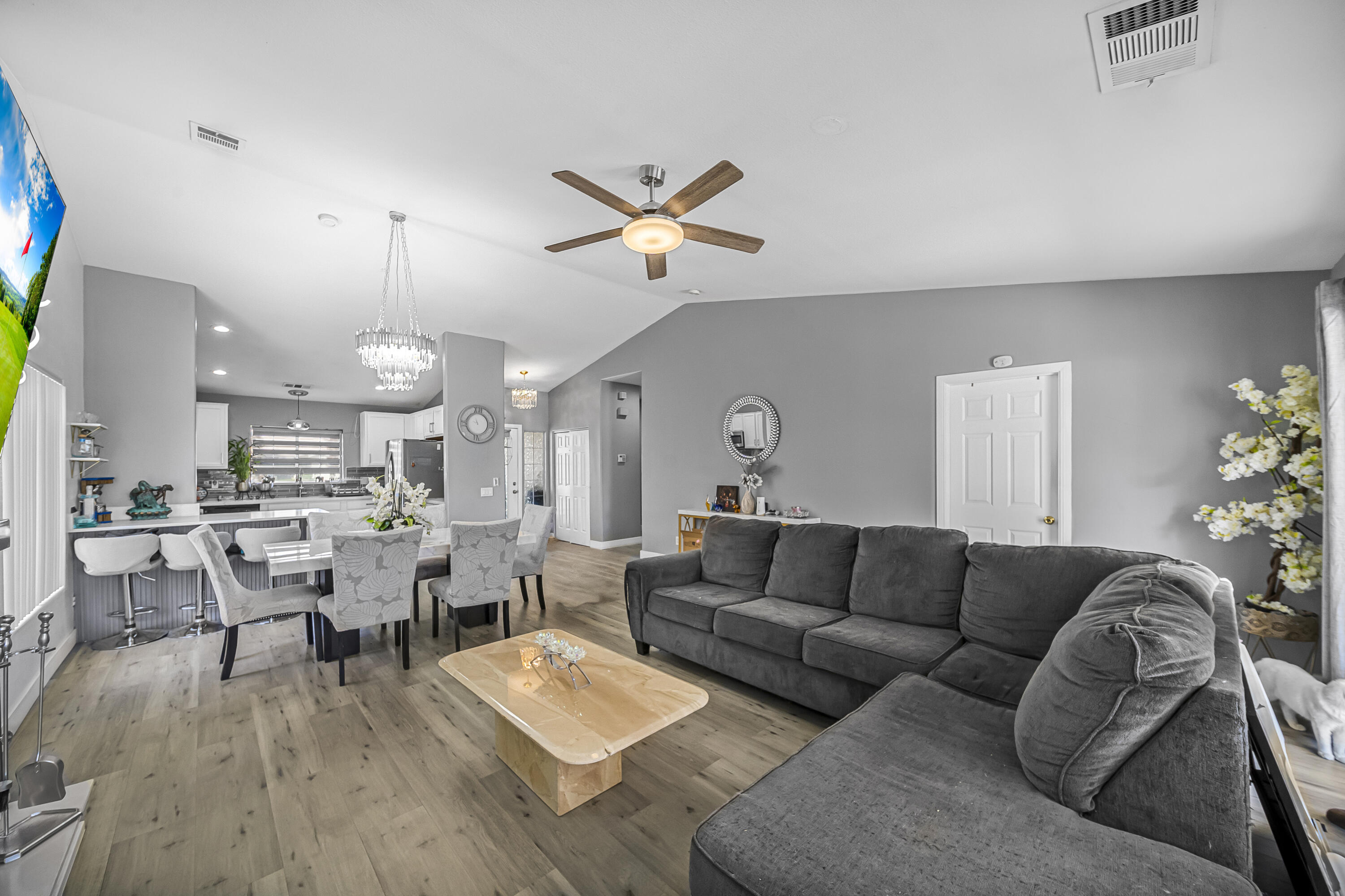 33860 Bell Road Thousand Palms, CA 92276 - Photo 17 of 56 a living room with lots of furniture and a large window