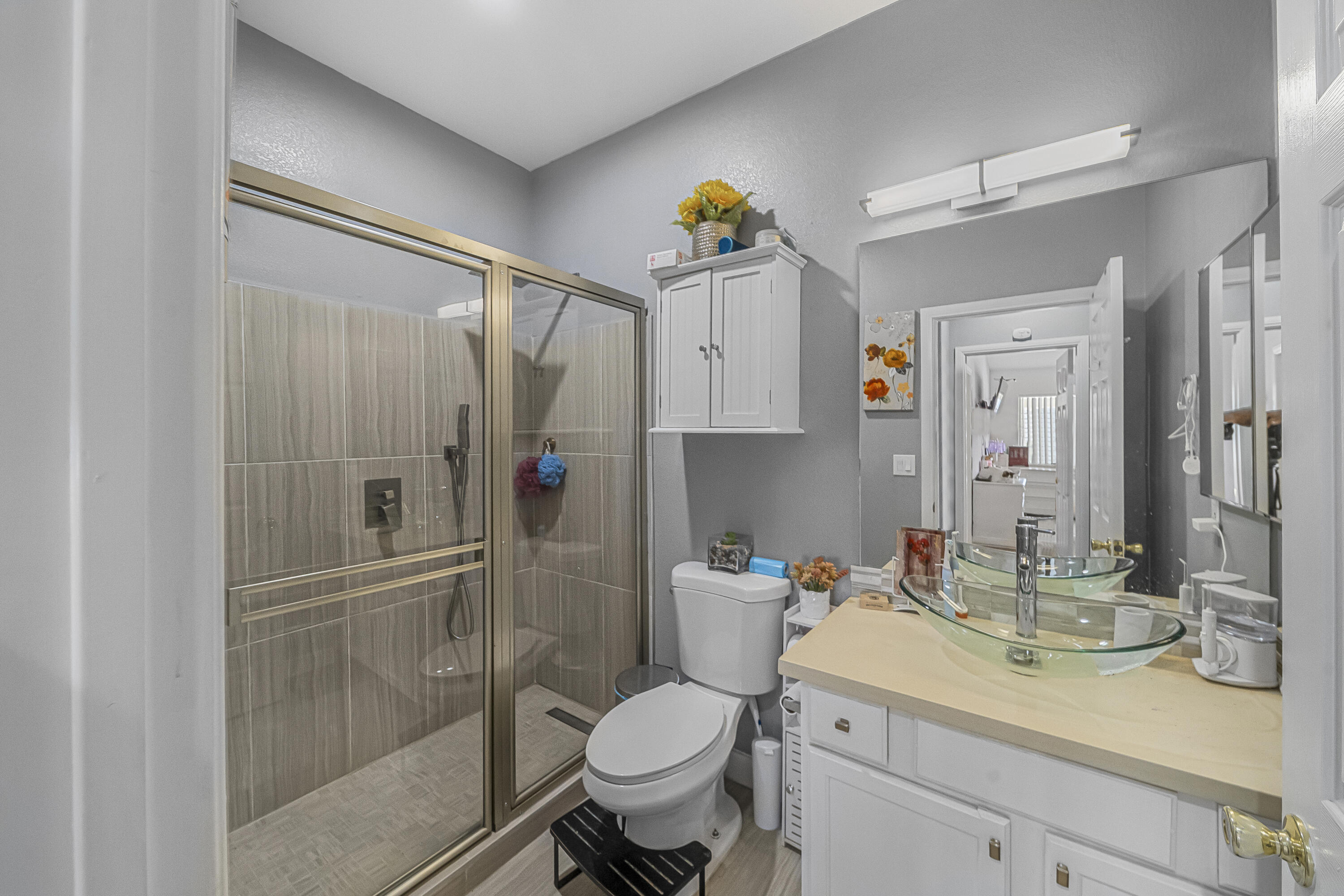 33860 Bell Road Thousand Palms, CA 92276 - Photo 18 of 56 a bathroom with a sink toilet and shower
