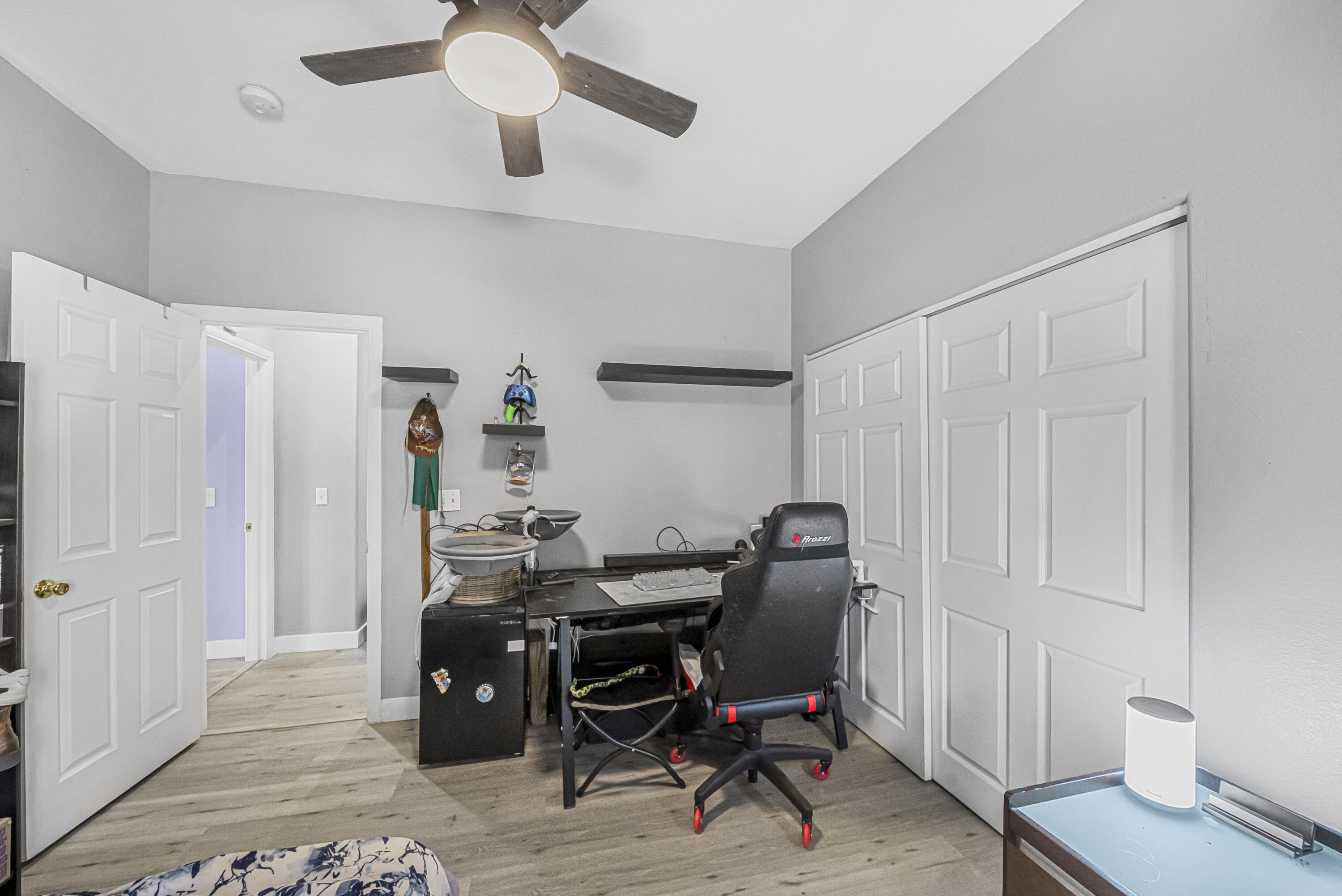 33860 Bell Road Thousand Palms, CA 92276 - Photo 21 of 56 a view of a workspace with furniture and a window