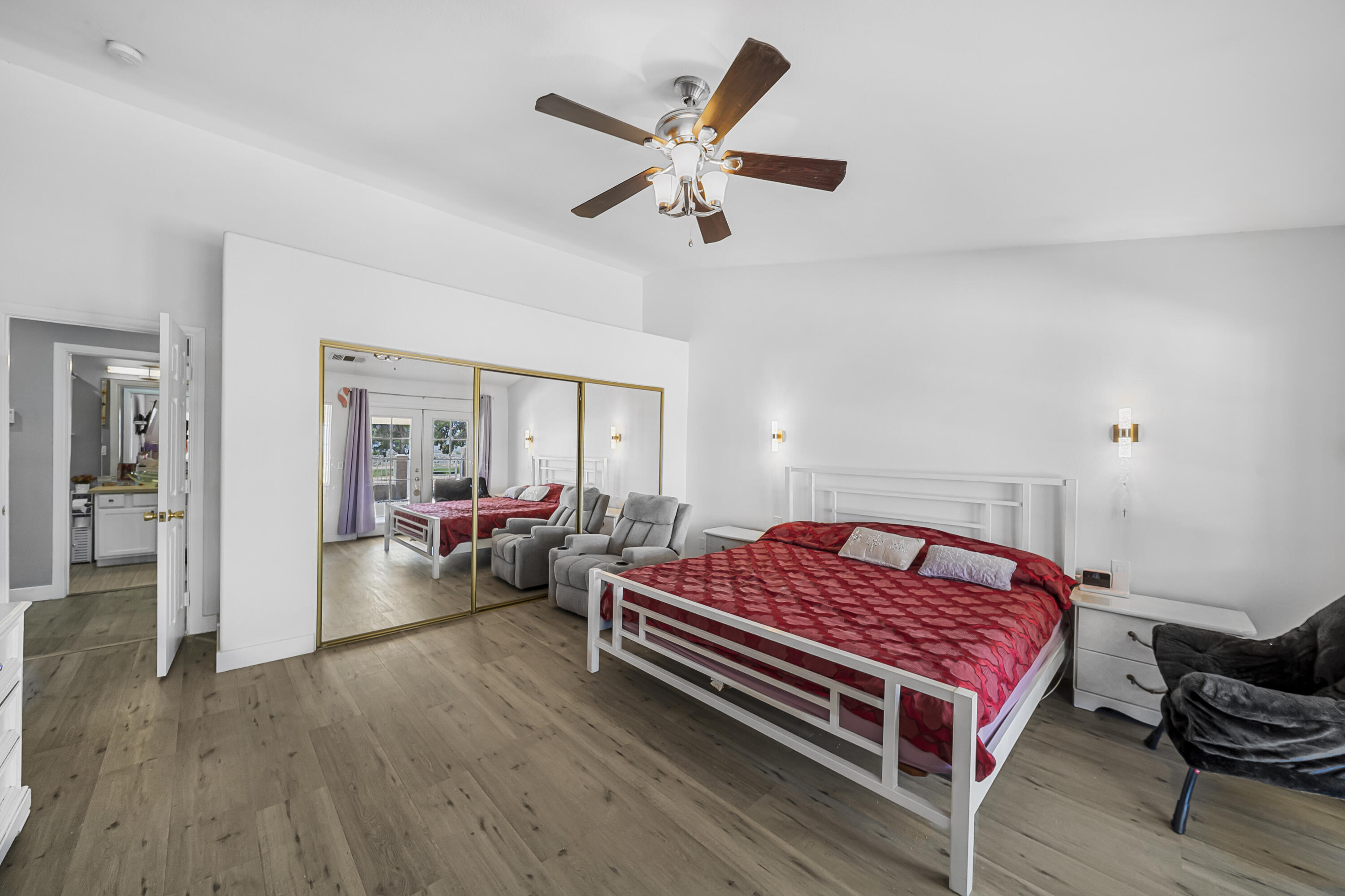 33860 Bell Road Thousand Palms, CA 92276 - Photo 23 of 56 a living room with furniture a rug and a ceiling fan