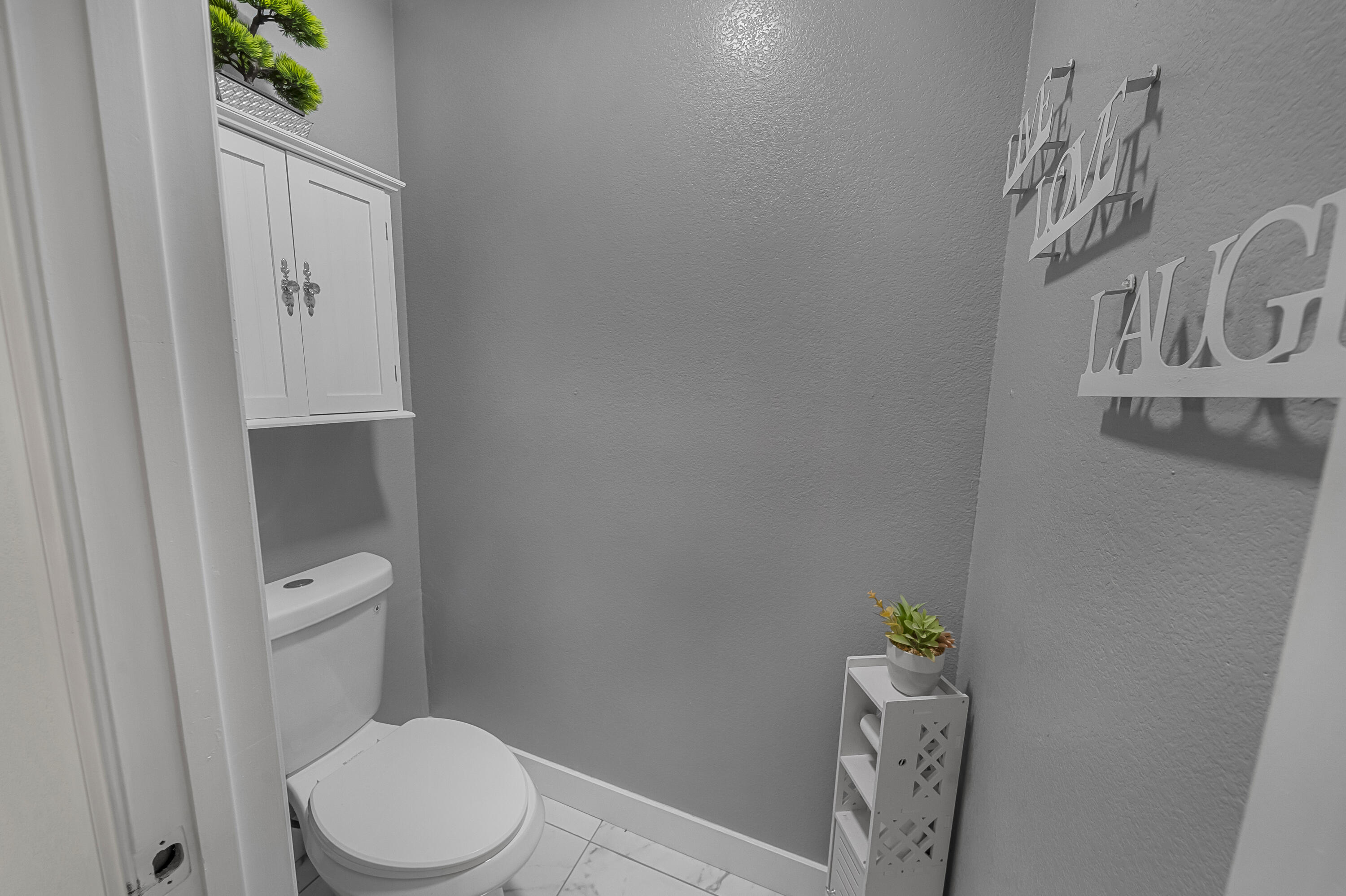 33860 Bell Road Thousand Palms, CA 92276 - Photo 26 of 56 a white toilet sitting next to a sink