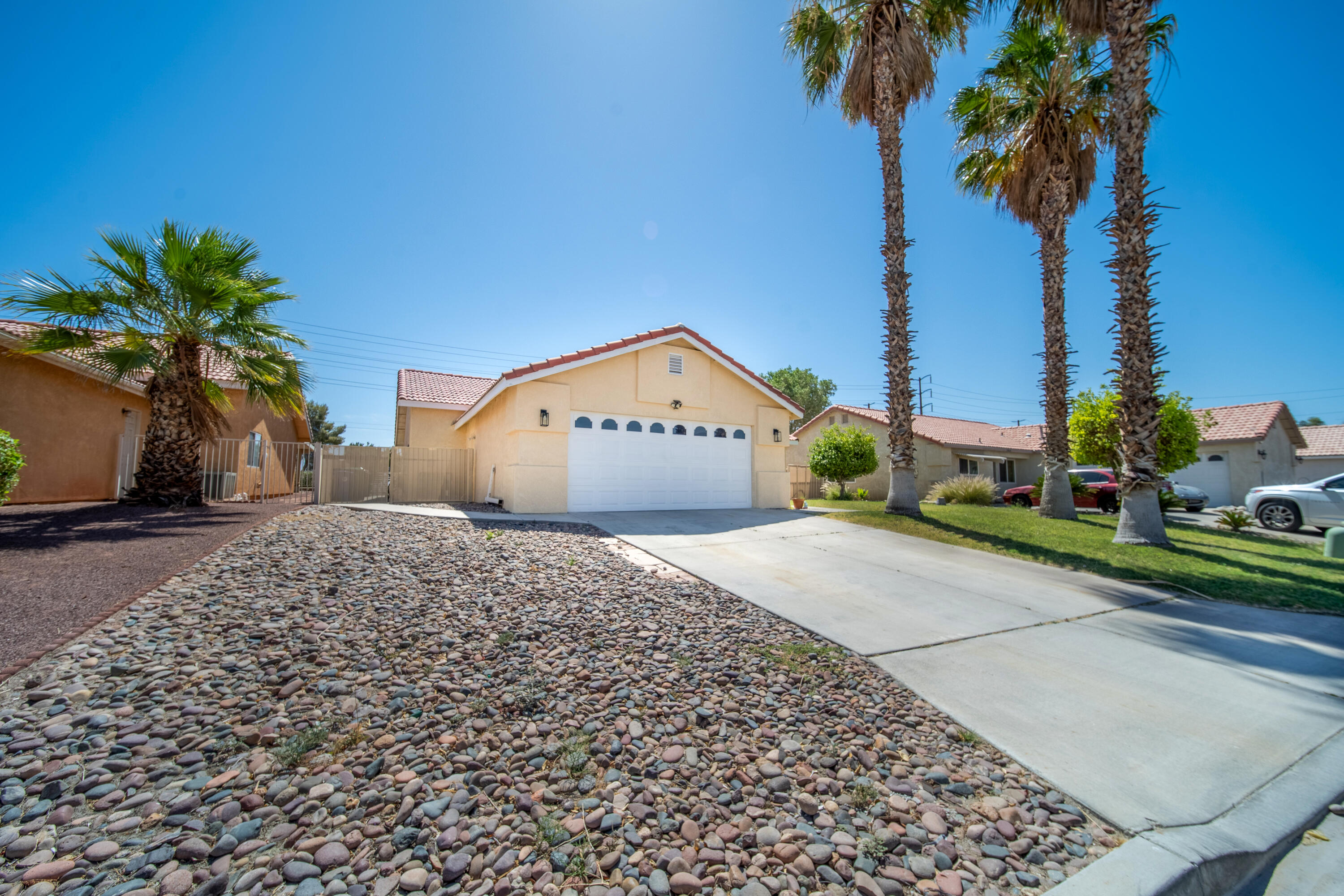 33860 Bell Road Thousand Palms, CA 92276 - Photo 45 of 56 a view of a house with a yard and plant