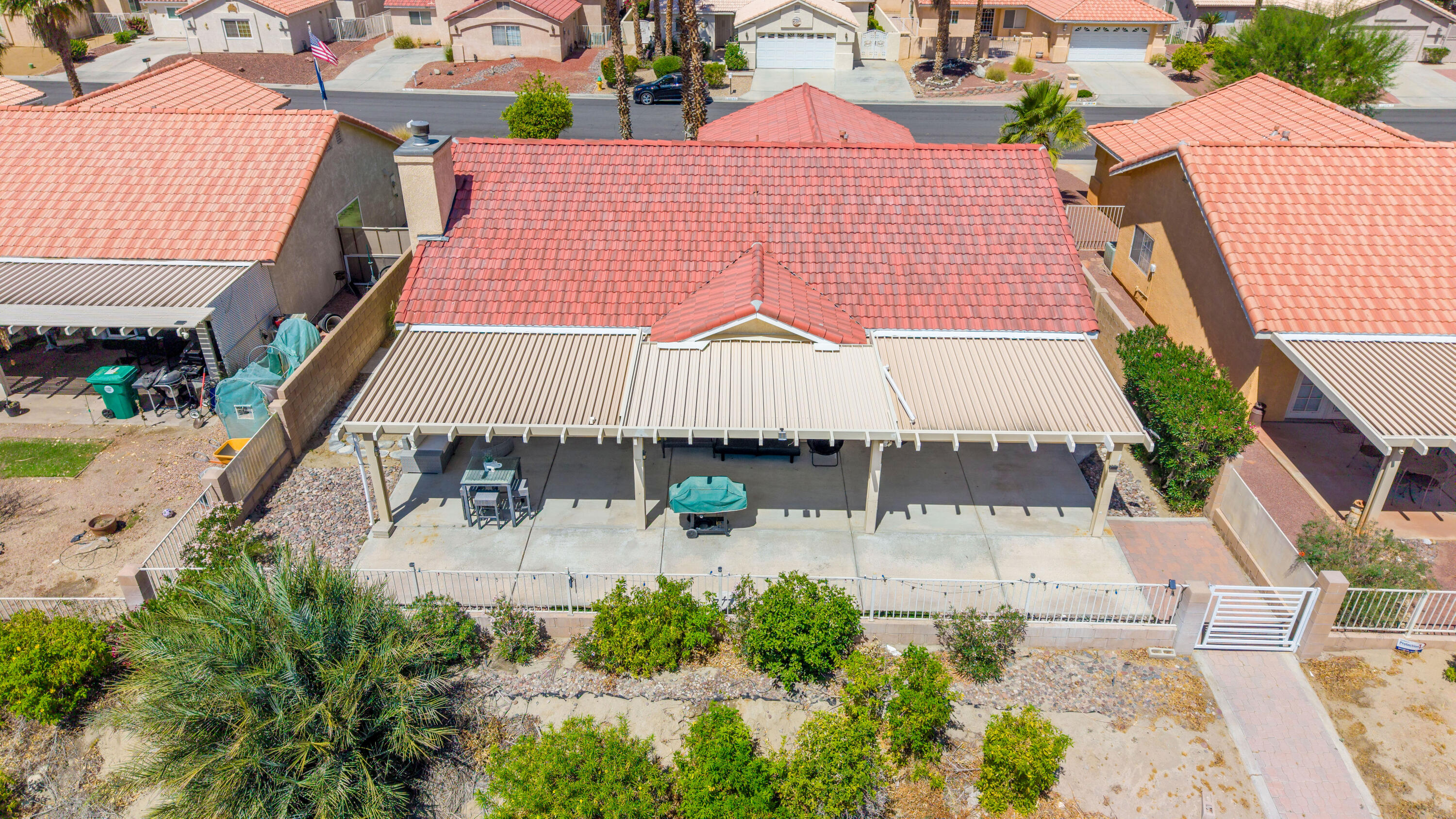 33860 Bell Road Thousand Palms, CA 92276 - Photo 50 of 56 an aerial view of a house with a yard and balcony