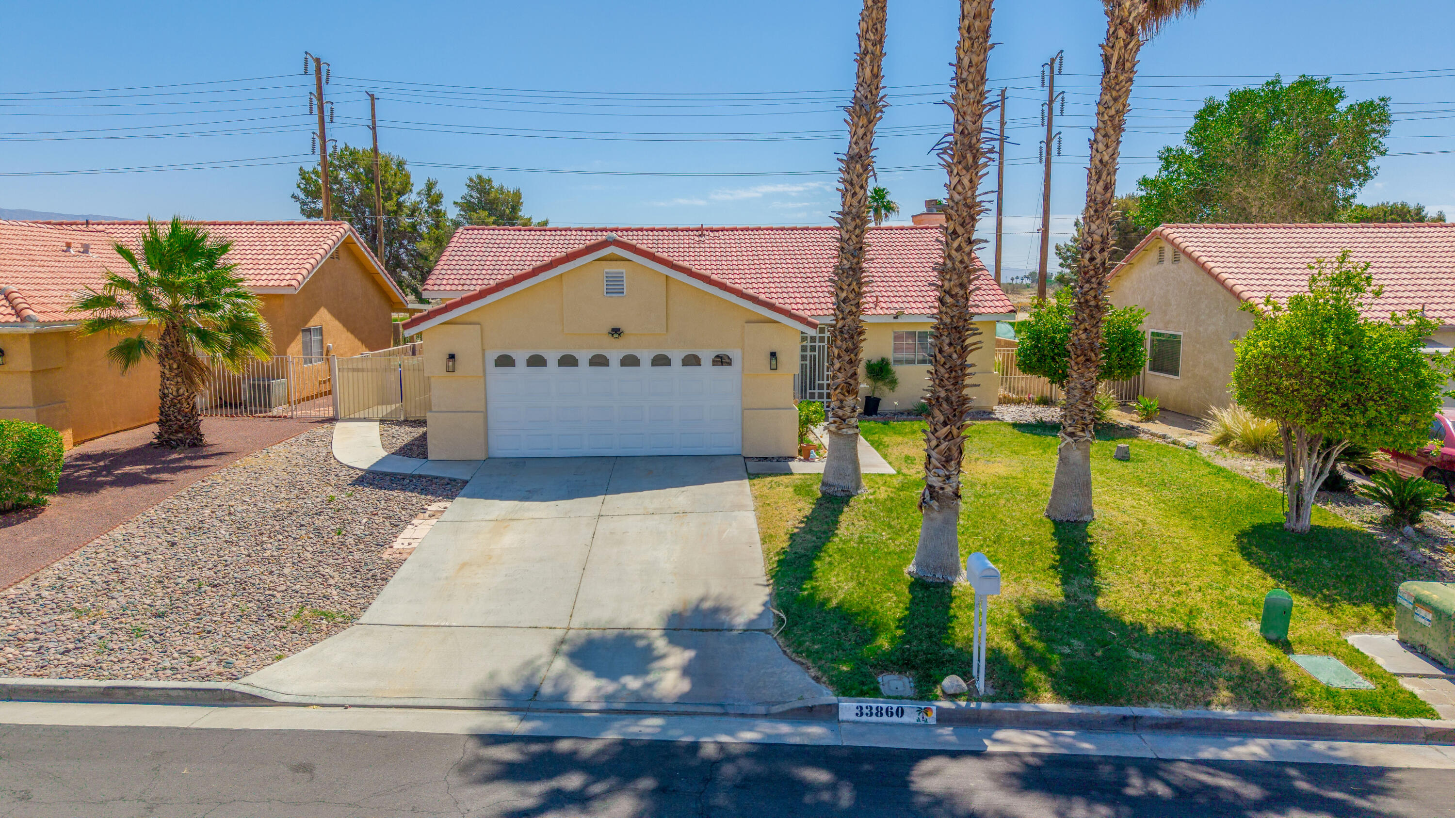 33860 Bell Road Thousand Palms, CA 92276 - Photo 5 of 56 a front view of a house with a yard