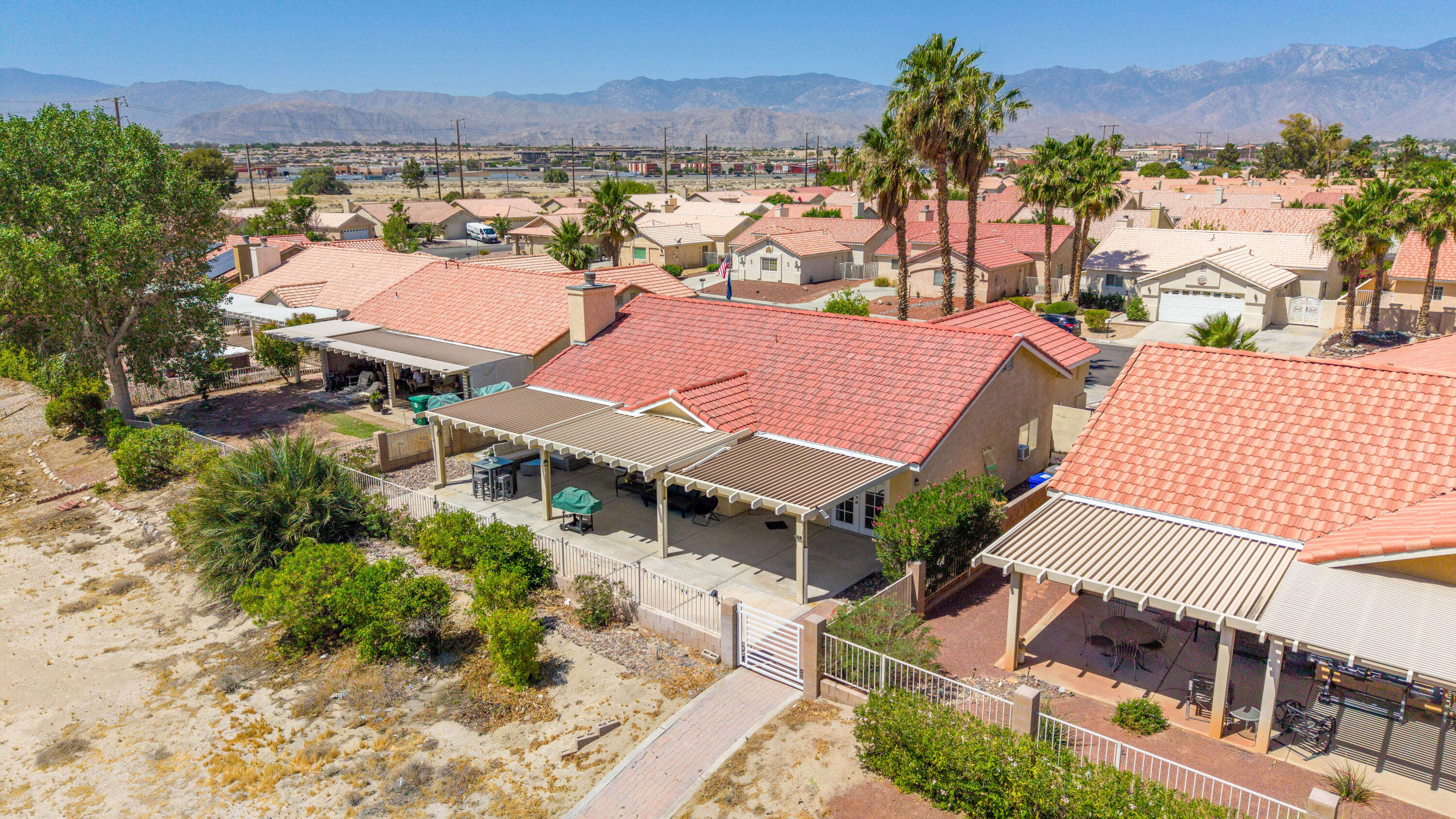 33860 Bell Road Thousand Palms, CA 92276 - Photo 52 of 56 an aerial view of multiple houses with a yard