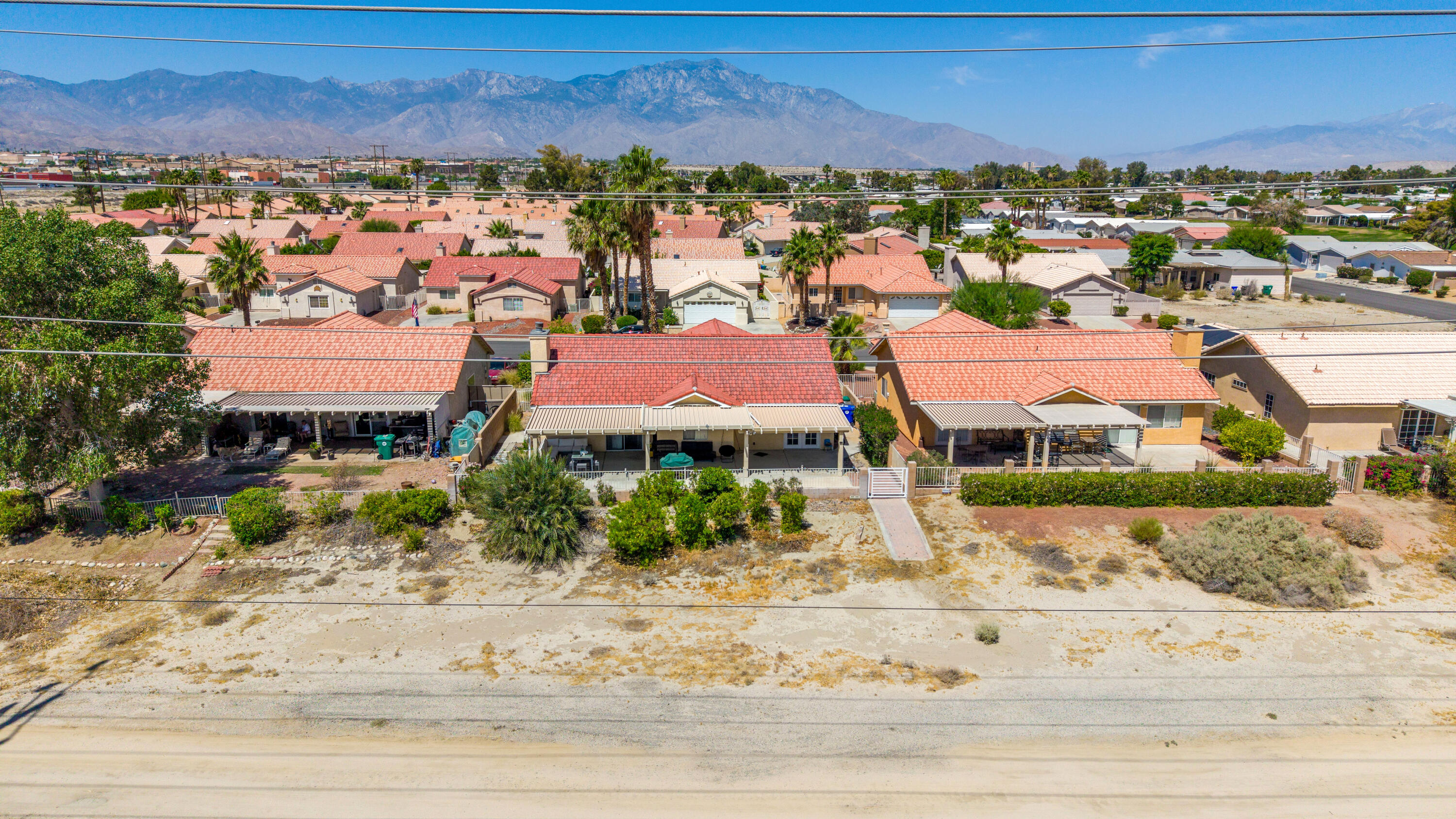 33860 Bell Road Thousand Palms, CA 92276 - Photo 53 of 56 an aerial view of residential houses with outdoor space and street view