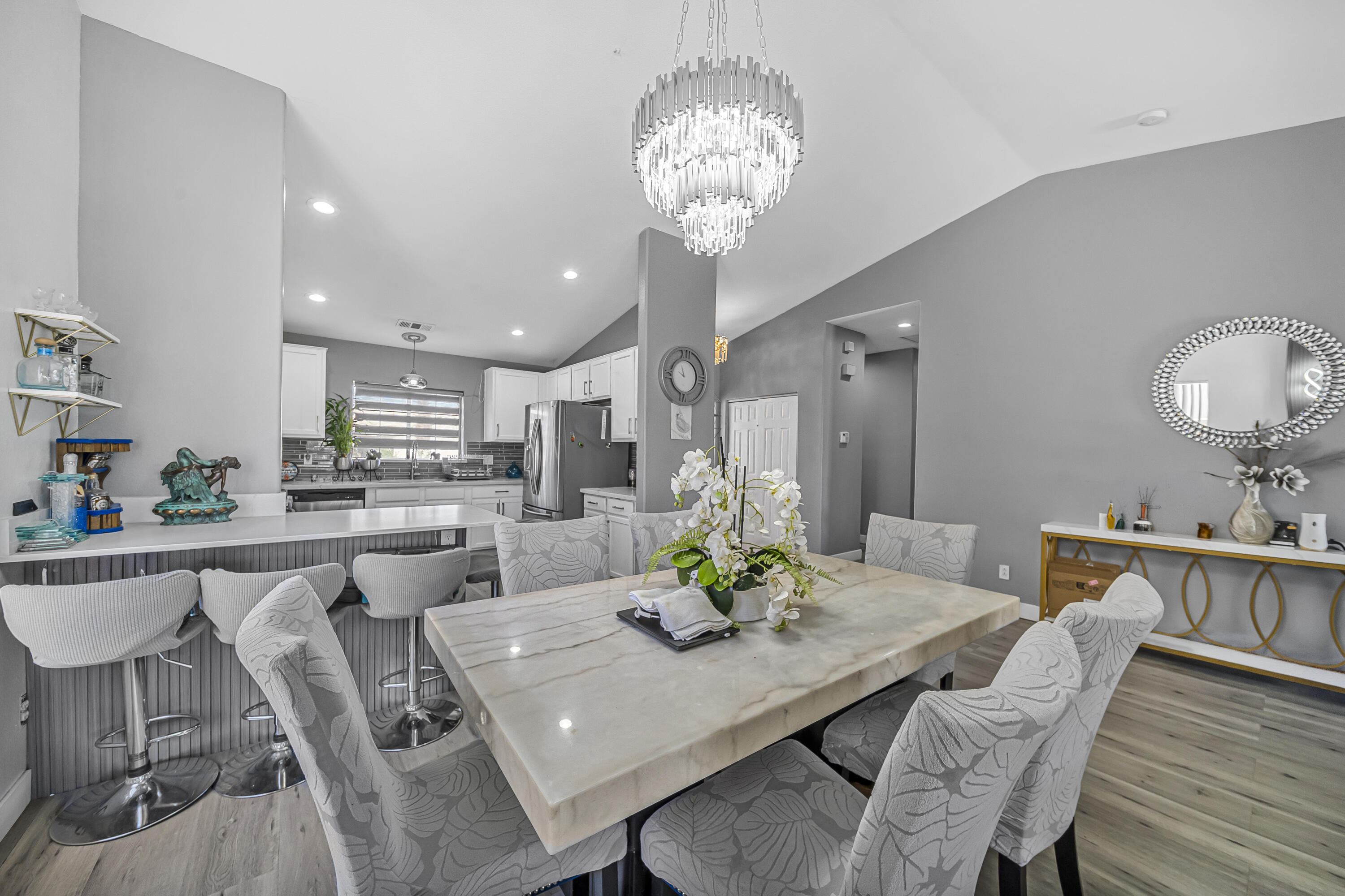33860 Bell Road Thousand Palms, CA 92276 - Photo 7 of 56 a view of a dining room with furniture and wooden floor