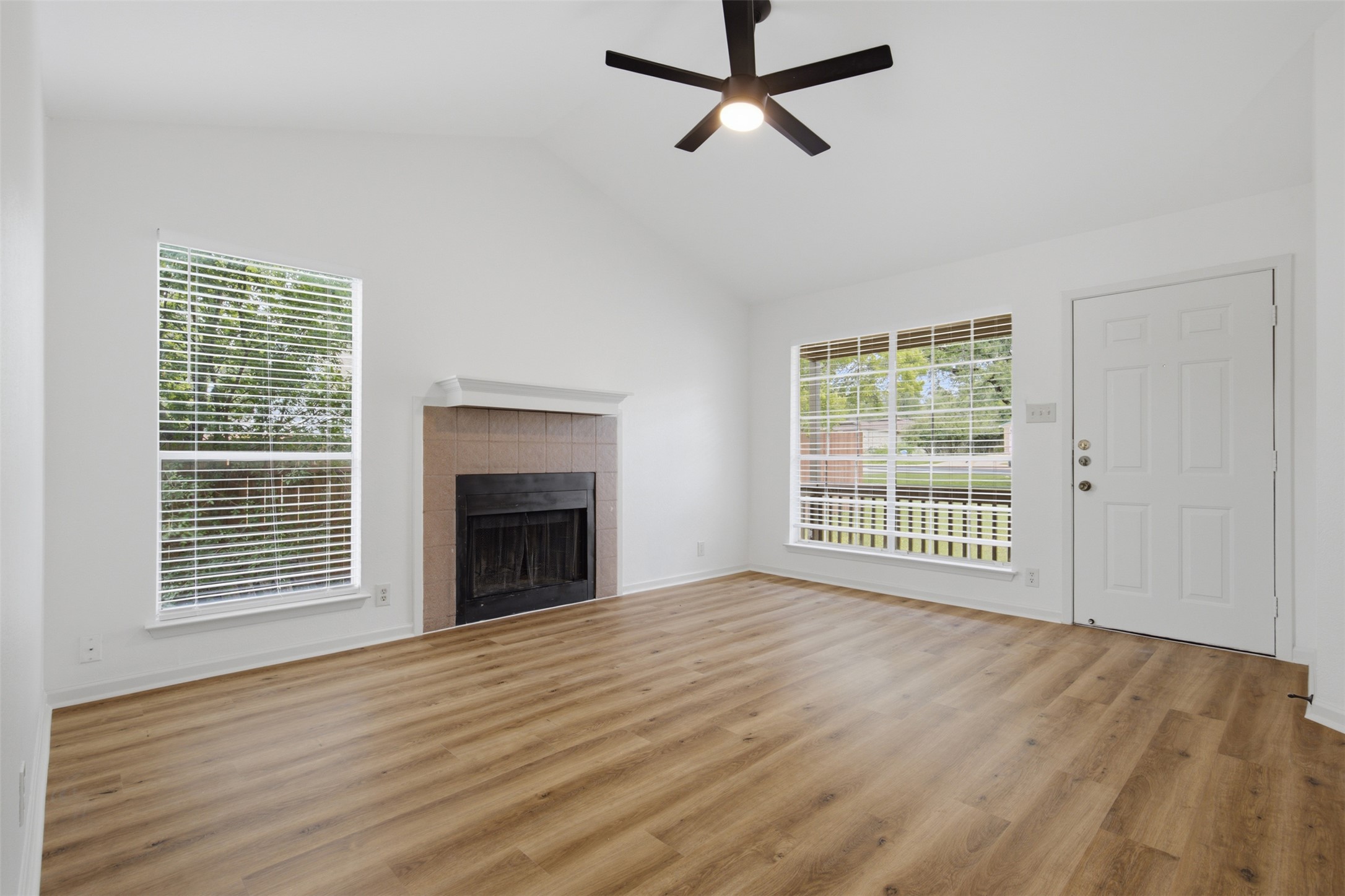 11611 Rustic Rock Drive, Unit B Austin, TX 78750 - Photo 4 of 30 Vast, open living space with soaring, vaulted ceilings and a warm, inviting fireplace.