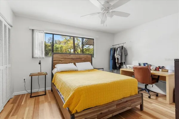 a bed room with a bed and a desk