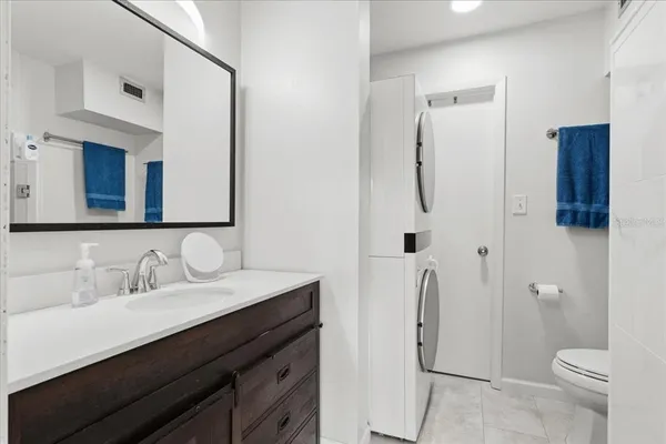 a bathroom with a glass shower door
