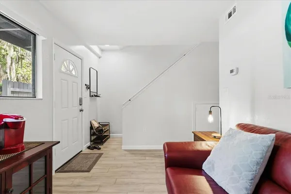 a work room with furniture and wooden floor