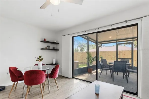 a view of a dining room with furniture window and outside view