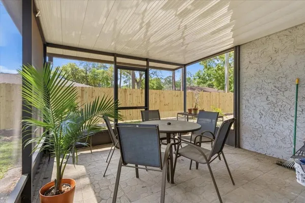 a view of a dining room with furniture window and outside view