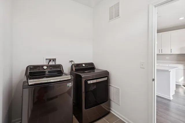 a stove top oven sitting inside of a kitchen