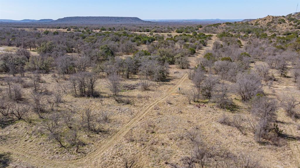 2263 South Main Street Gordon, TX 76453 - Photo 8 of 16 a view of a dry field with mountains in the background