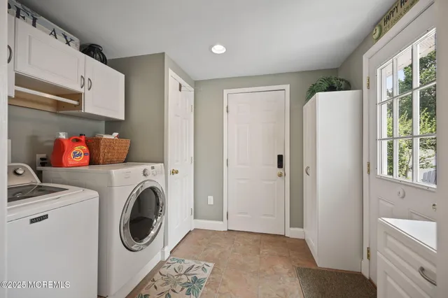 a bedroom with a bed and flat screen tv