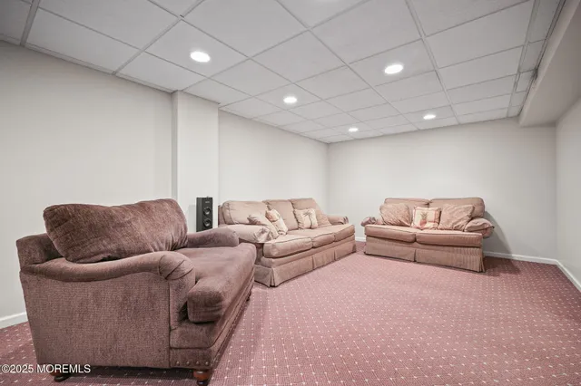 an aerial view of residential houses with city and outdoor space