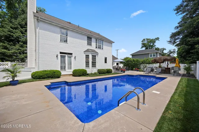 an aerial view of multiple houses with yard
