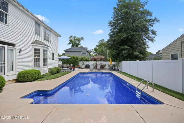 an aerial view of a residential houses with city view and mountain view