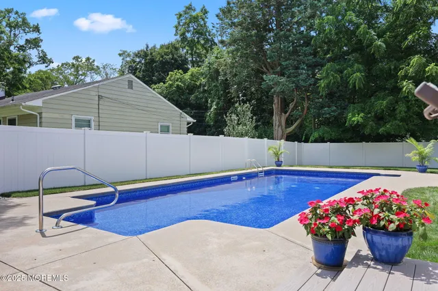 an aerial view of house with yard