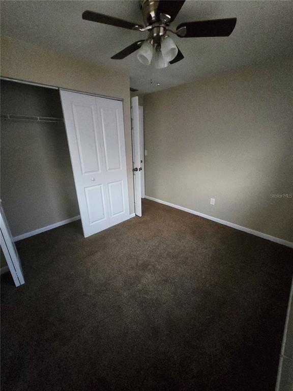 4370 Osage Lane Spring Hill, FL 34608 - Photo 7 of 11 an empty room with a ceiling fan and window