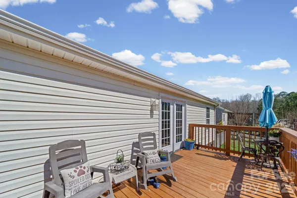 a balcony view with a seating space