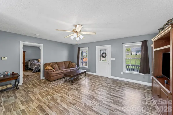 a living room with furniture and a flat screen tv