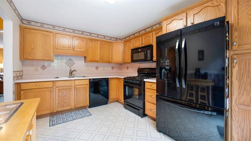 140 Terra Drive McKees Rocks, PA 15136 - Photo 11 of 25 Oak cabinetry with black appliances included.