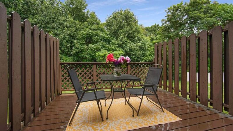 140 Terra Drive McKees Rocks, PA 15136 - Photo 12 of 25 Deck just off the kitchen with privacy side panels and view of the wooded rear of lot