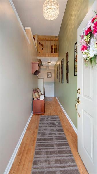 140 Terra Drive McKees Rocks, PA 15136 - Photo 3 of 25 Front entry hallway with access to both the lower level and the open staircase to the main level