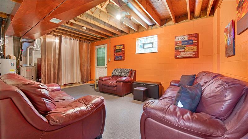 140 Terra Drive McKees Rocks, PA 15136 - Photo 21 of 25 Partially finished lower level with door to the backyard