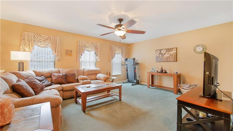 140 Terra Drive McKees Rocks, PA 15136 - Photo 5 of 25 Spacious living room with horizontal blinds and window treatments are included