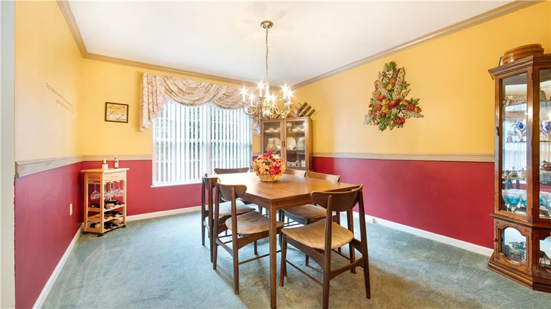 140 Terra Drive McKees Rocks, PA 15136 - Photo 8 of 25 Spacious dining room with vertical blinds and window treatments which are included.