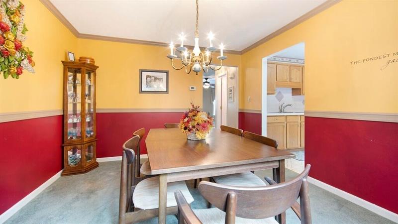 140 Terra Drive McKees Rocks, PA 15136 - Photo 9 of 25 Dining room with chair rail and crown molding looking into the kitchen