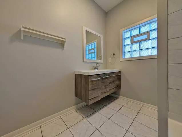 a room with a window and mirror