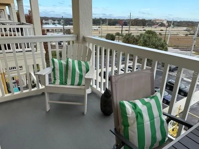 a view of swimming pool with outdoor seating and plants