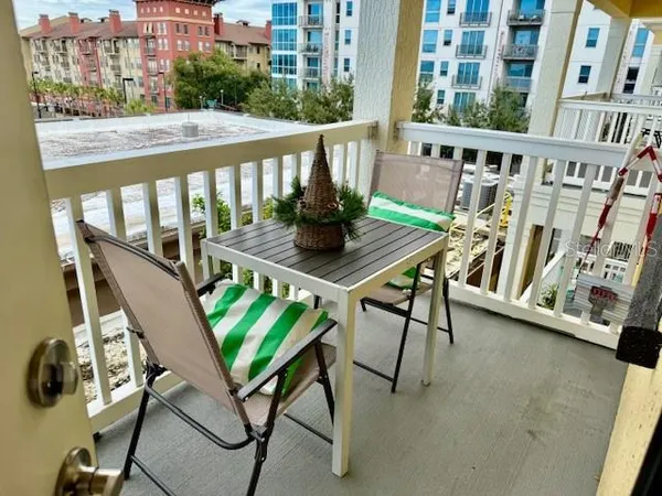 a view of swimming pool with outdoor seating and plants