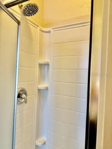 a view of a swimming pool with a lounge chair