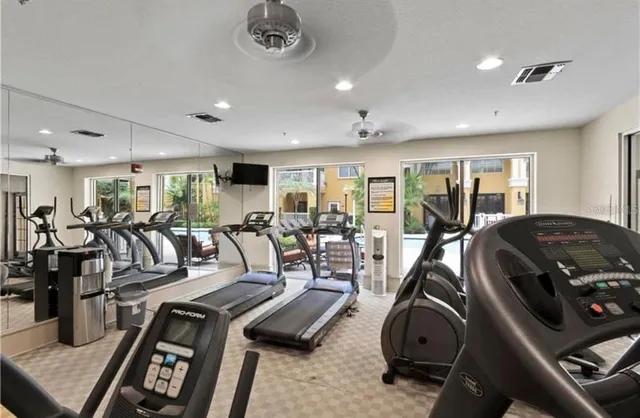 a large bed sitting in a bedroom next to a window