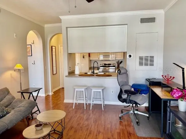a stove top oven sitting inside of a kitchen
