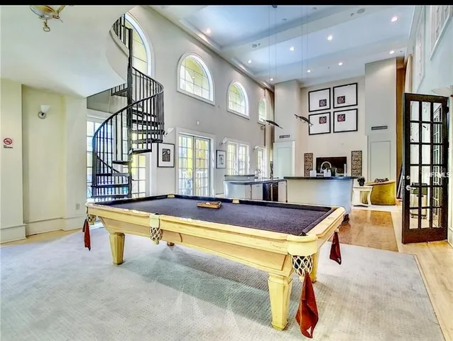 a en suite bathroom with a granite countertop sink and a mirror