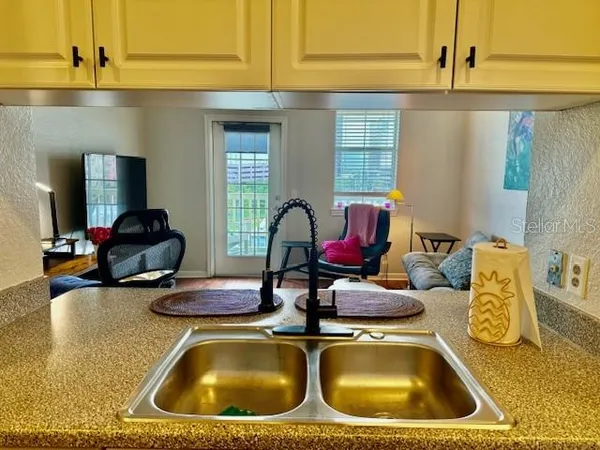 a kitchen with a stove and cabinets