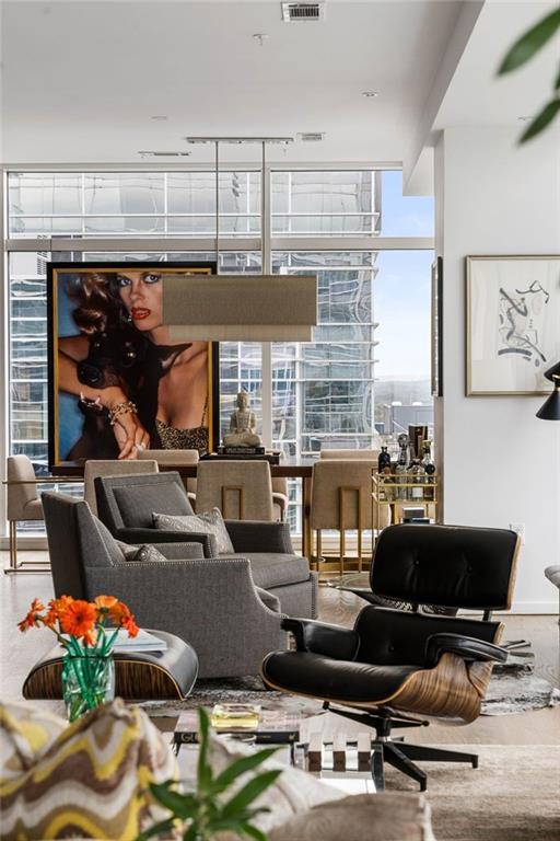 45 Ivan Allen Jr Boulevard Northwest, Unit 1702 Atlanta, GA 30308 - Photo 14 of 94 a room with gym equipment and a large window