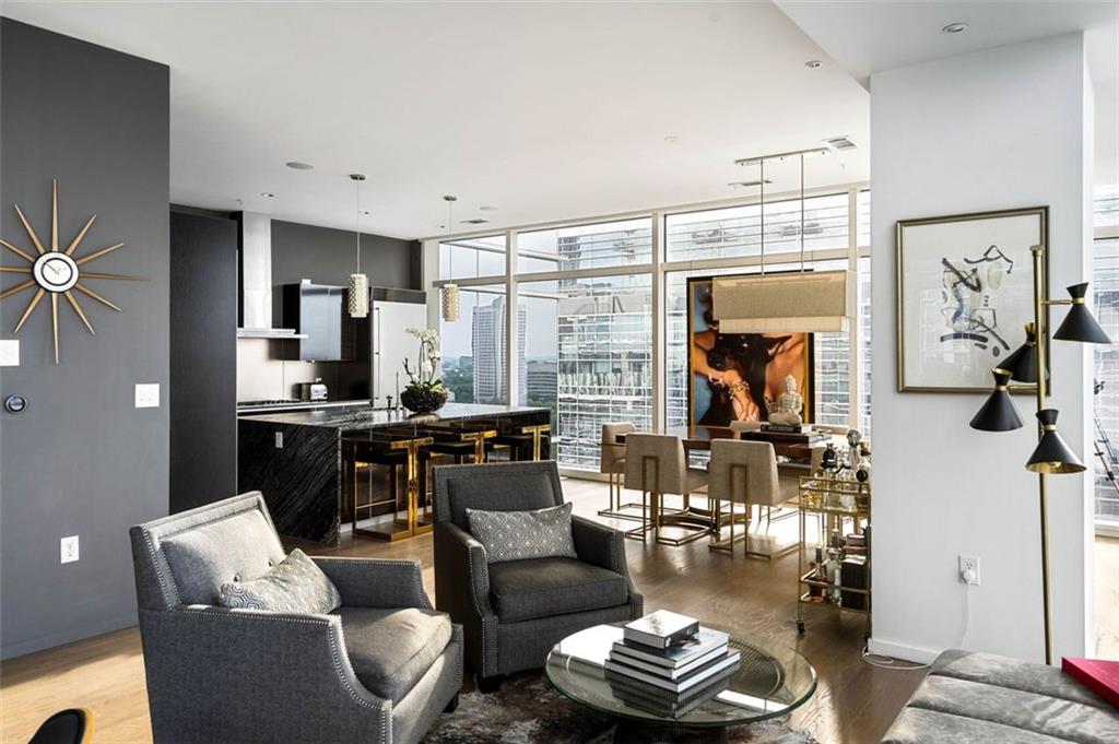 45 Ivan Allen Jr Boulevard Northwest, Unit 1702 Atlanta, GA 30308 - Photo 17 of 94 a living room with furniture and a view of kitchen