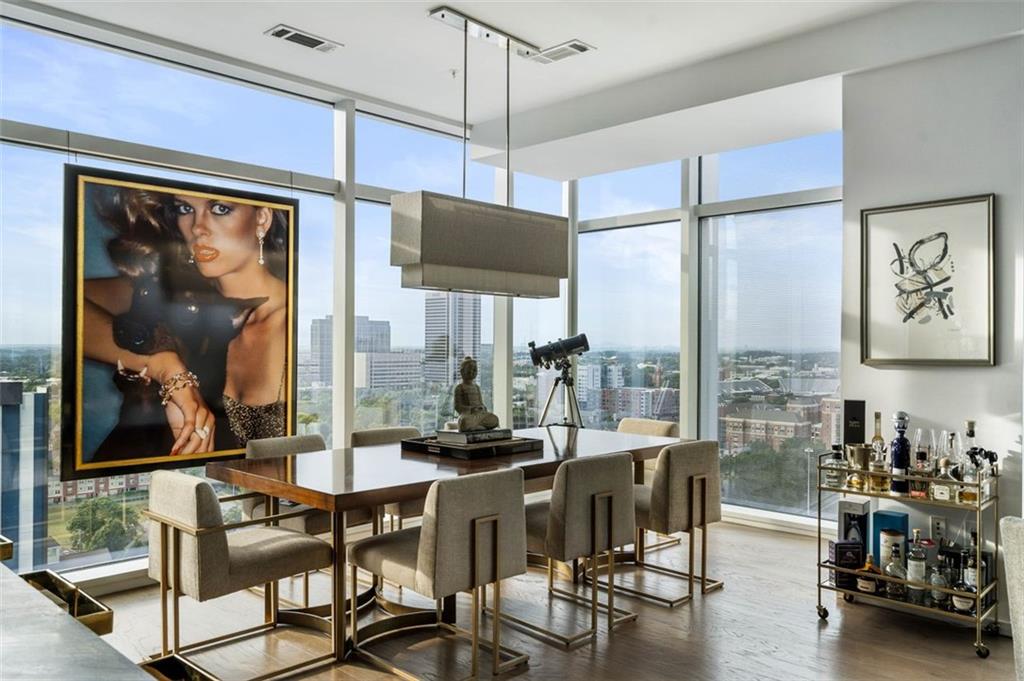 45 Ivan Allen Jr Boulevard Northwest, Unit 1702 Atlanta, GA 30308 - Photo 29 of 94 a view of a dining room with furniture window and wooden floor