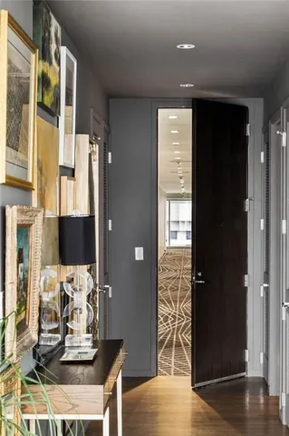 a living room with furniture and a floor to ceiling window