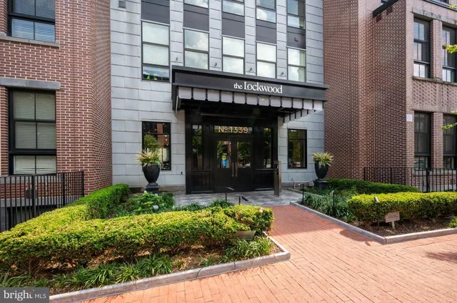 a view of a building with potted plants