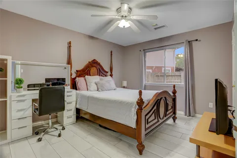 a bed room with a bed and a television