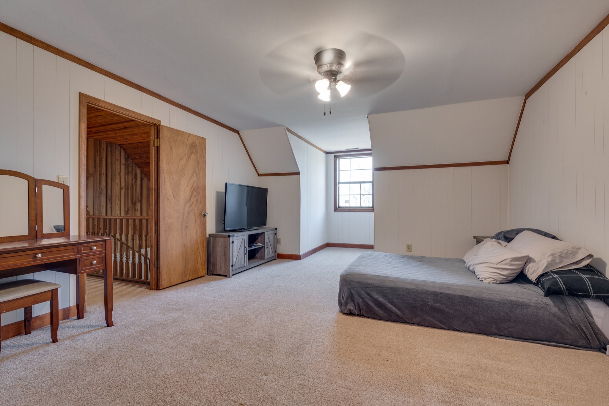 324 Shorts Road Pulaski, TN 38478 - Photo 22 of 40 a bedroom with a bed and a chandelier