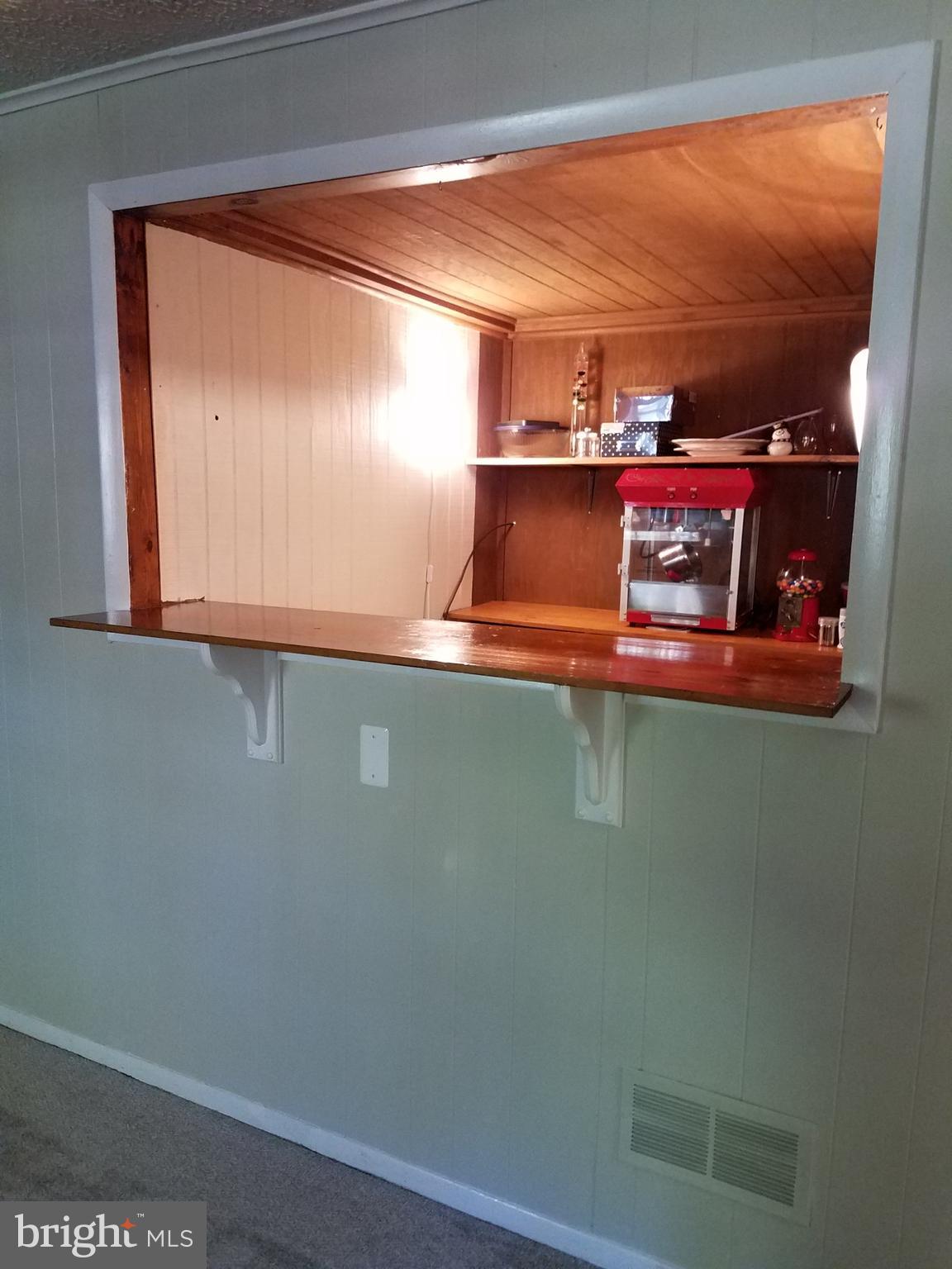 3003 Marlin Drive Riva, MD 21140 - Photo 11 of 36 a room with water heater and wooden cabinets